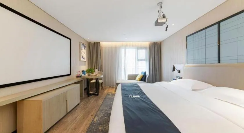 Bed in Echarm Hotel Wuhan Huangpi Xiangyang Avenue