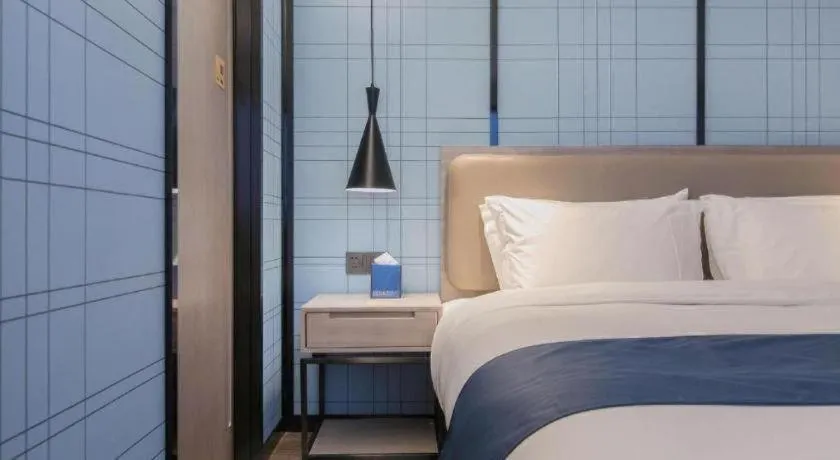 Bed in Echarm Hotel Wuhan Huangpi Xiangyang Avenue