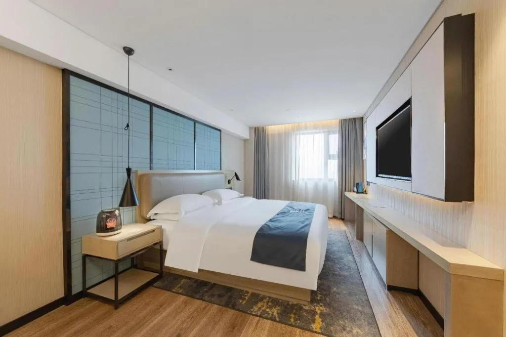Bed in Echarm Hotel Wuhan Huangpi Xiangyang Avenue