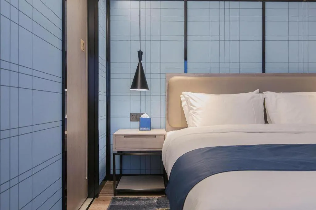 Bed in Echarm Hotel Wuhan Huangpi Xiangyang Avenue