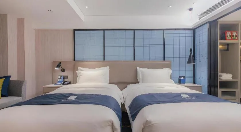 Bed in Echarm Hotel Wuhan Huangpi Xiangyang Avenue