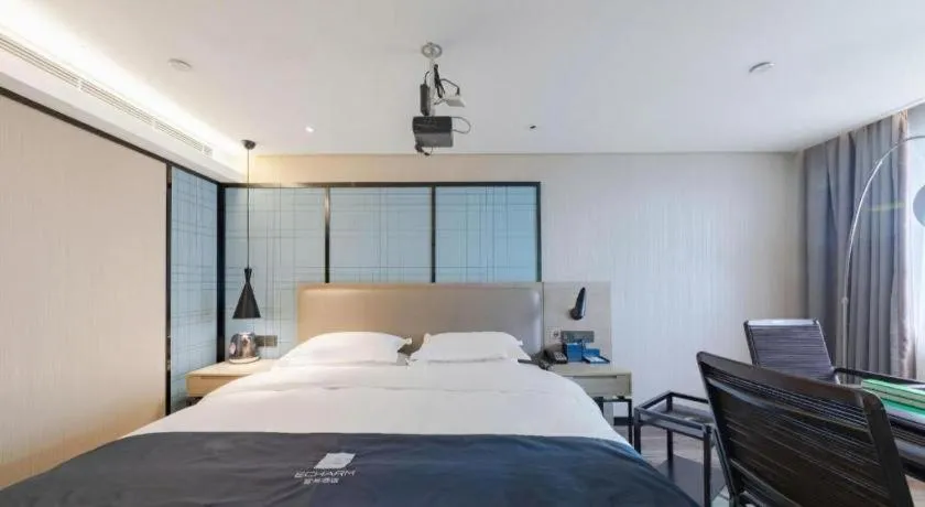 Bed in Echarm Hotel Wuhan Huangpi Xiangyang Avenue