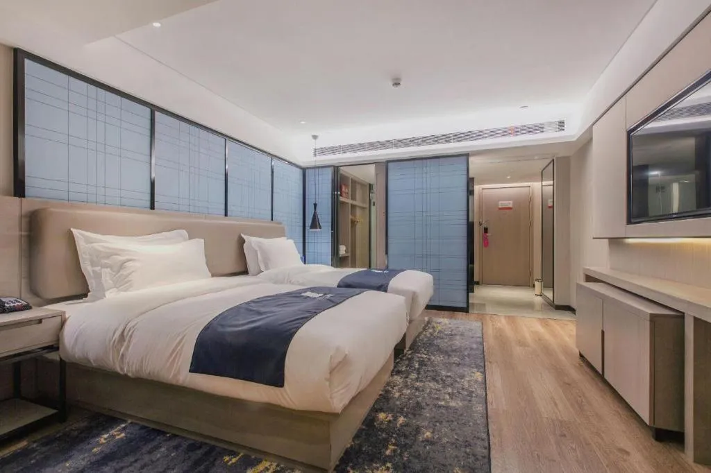 Bed in Echarm Hotel Wuhan Huangpi Xiangyang Avenue