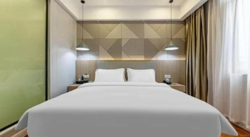 Bed in Borrman Hotel Shaoguan Century East Street Fengcai Building