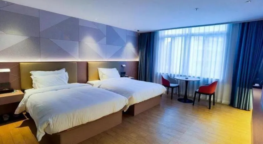 Bed in Borrman Hotel Shaoguan Century East Street Fengcai Building