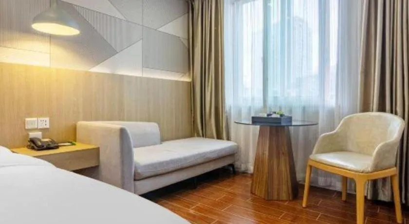 Bed in Borrman Hotel Shaoguan Century East Street Fengcai Building