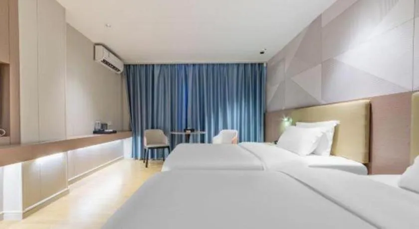 Bed in Borrman Hotel Shaoguan Century East Street Fengcai Building