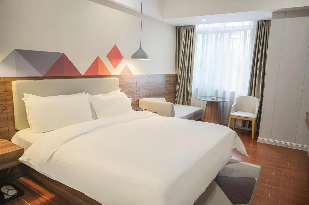 Bed in Borrman Hotel Shaoguan Century East Street Fengcai Building
