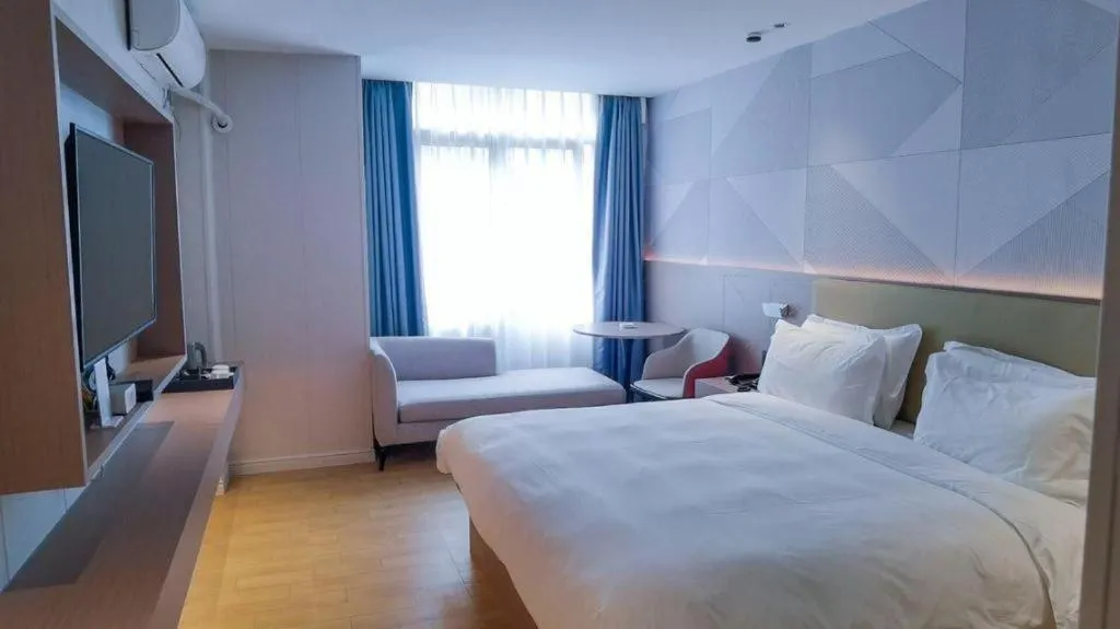 Bed in Borrman Hotel Shaoguan Century East Street Fengcai Building
