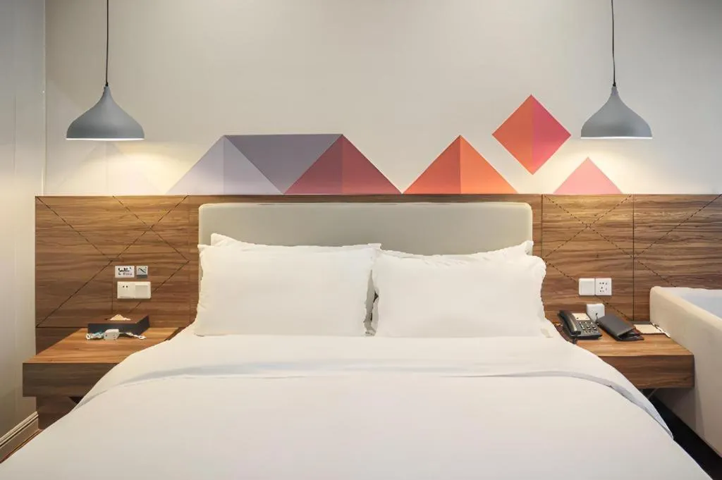 Bed in Borrman Hotel Shaoguan Century East Street Fengcai Building