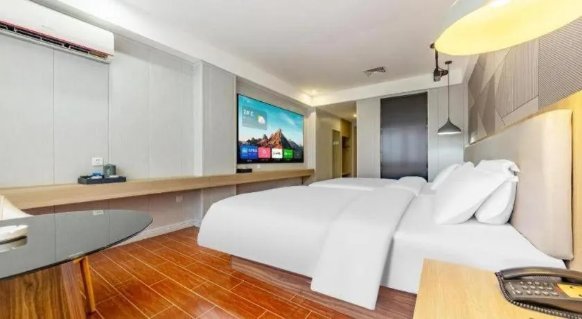 Bed in Borrman Hotel Shaoguan Century East Street Fengcai Building