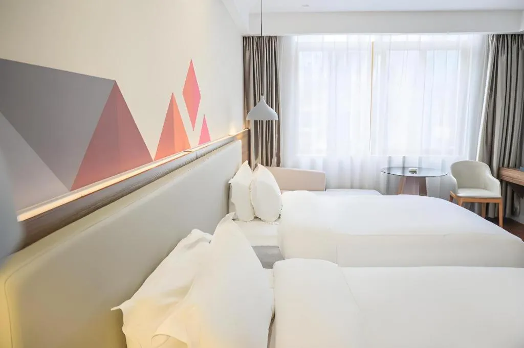 Bed in Borrman Hotel Shaoguan Century East Street Fengcai Building
