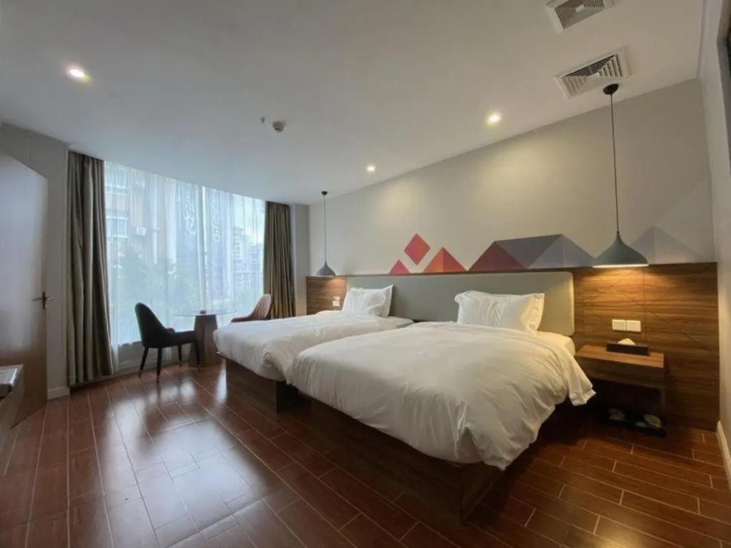 Bed in Borrman Hotel Shaoguan Century East Street Fengcai Building