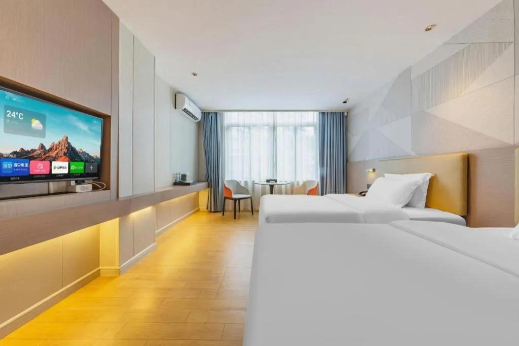 Bed in Borrman Hotel Shaoguan Century East Street Fengcai Building