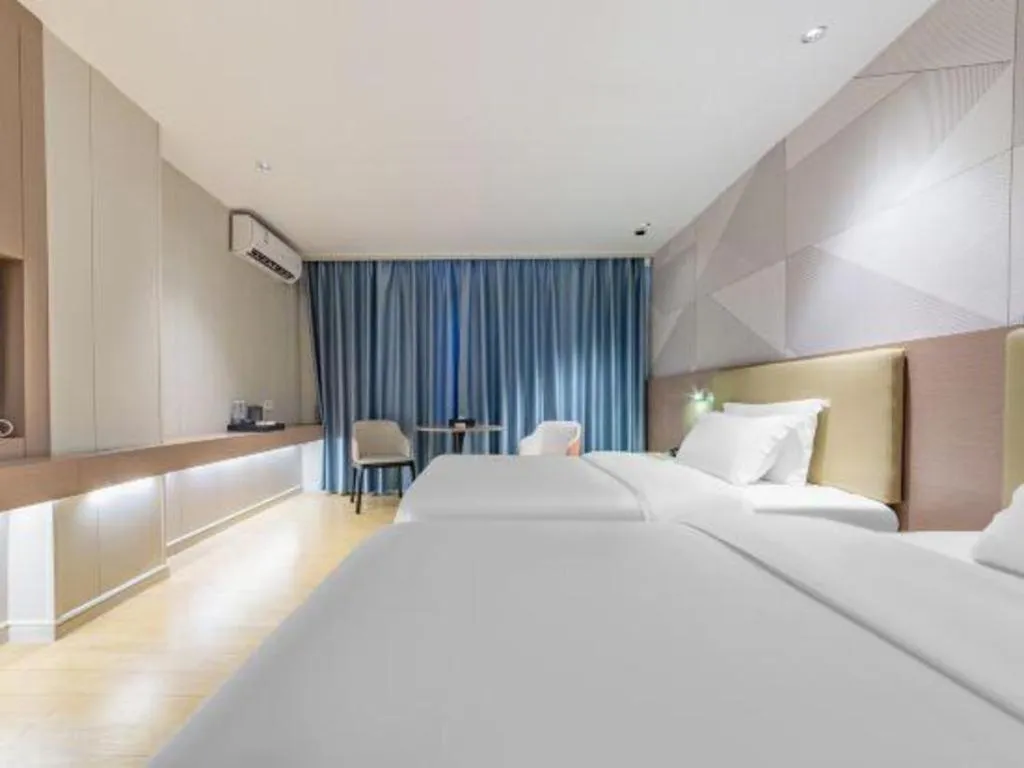 Bed in Borrman Hotel Shaoguan Century East Street Fengcai Building