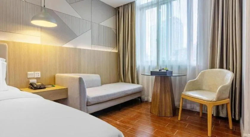 Bed in Borrman Hotel Shaoguan Century East Street Fengcai Building
