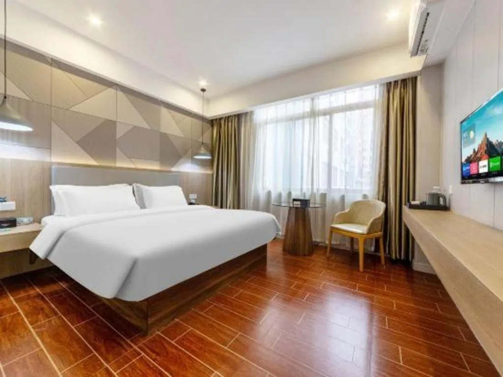 Bed in Borrman Hotel Shaoguan Century East Street Fengcai Building
