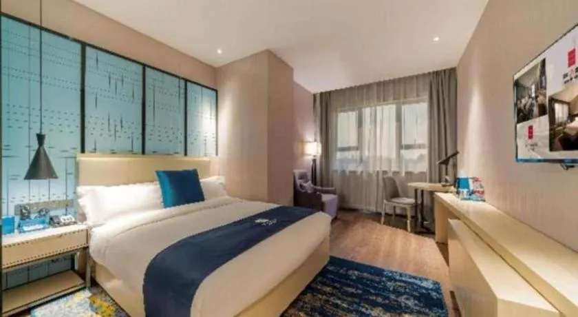 Bed in Echarm Hotel Foshan Jiaokou Metro Station Jiazhou Plaza