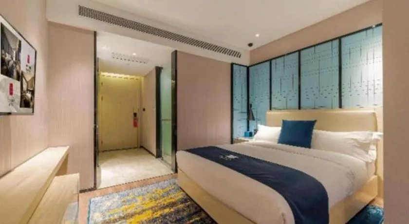 Bed in Echarm Hotel Foshan Jiaokou Metro Station Jiazhou Plaza