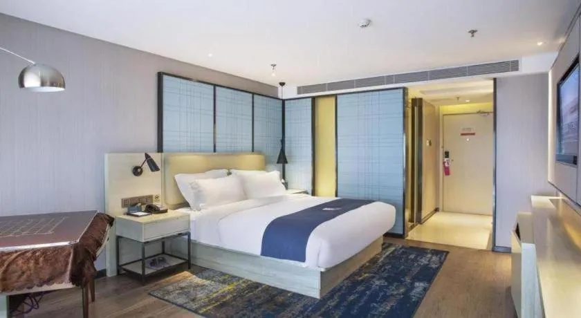 Bed in Echarm Hotel Guiyang North High-speed Railway Station