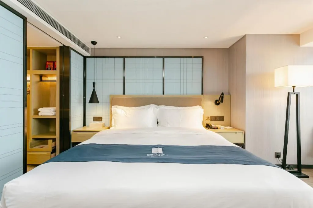 Bed in Echarm Hotel Guiyang North High-speed Railway Station