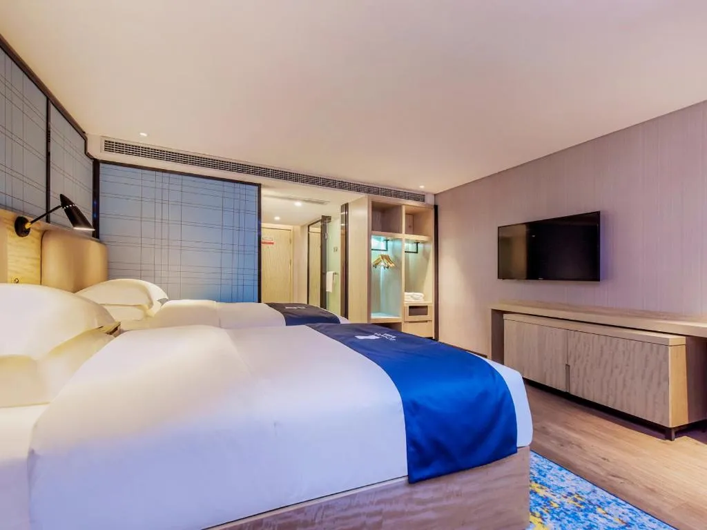 Bed in Echarm Hotel Guiyang North High-speed Railway Station