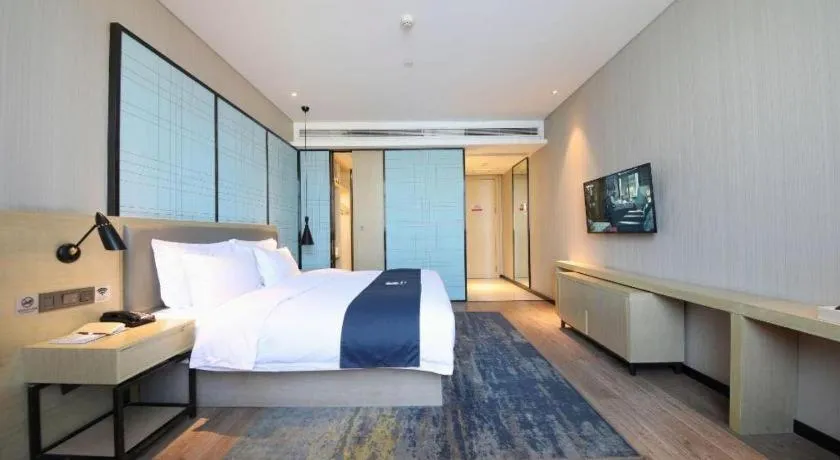 Bed in Echarm Hotel Guiyang North High-speed Railway Station