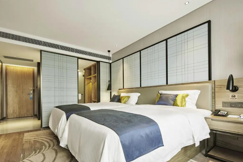 Bed in Echarm Hotel Guiyang North High-speed Railway Station
