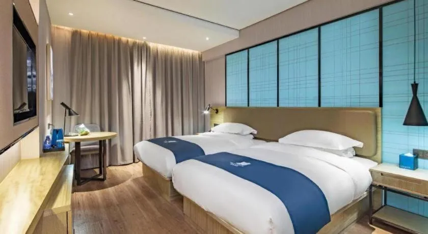 Bed in Echarm Hotel Guilin Railway Station the MixC