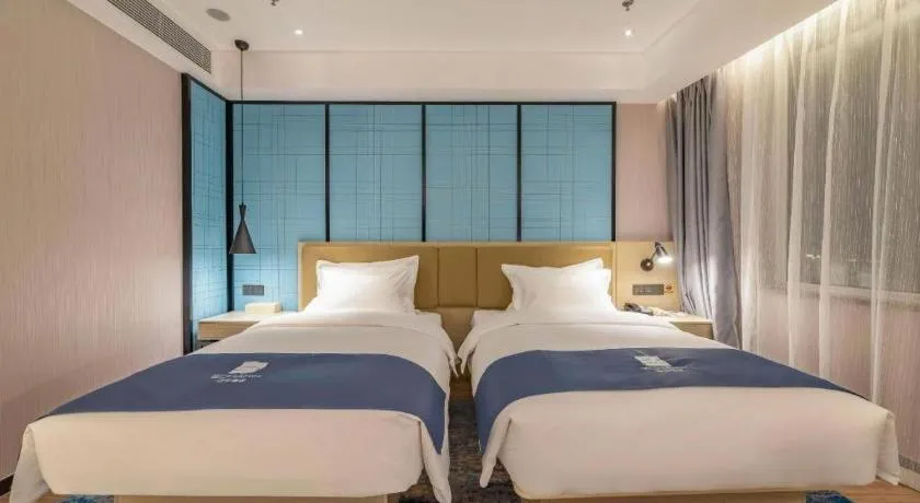 Bed in Echarm Hotel Tai'an Taishan Tianwai Village Hongmen