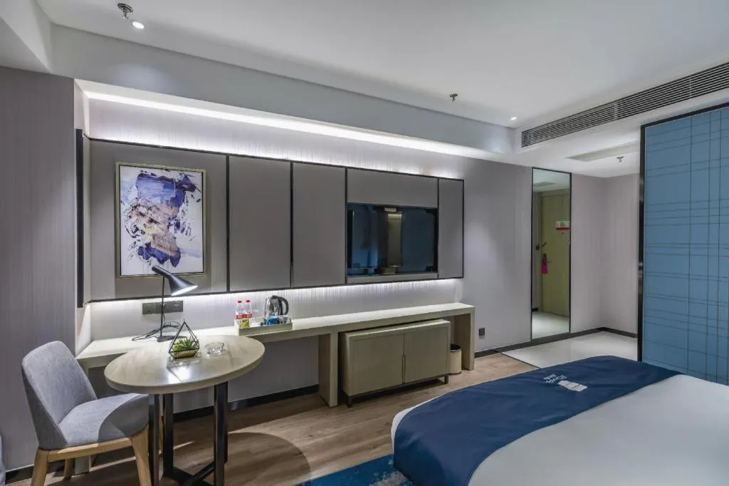 Bed in Echarm Hotel Tai'an Taishan Tianwai Village Hongmen