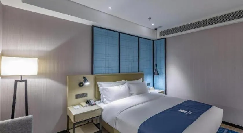 Bed in Echarm Hotel Tai'an Taishan Tianwai Village Hongmen