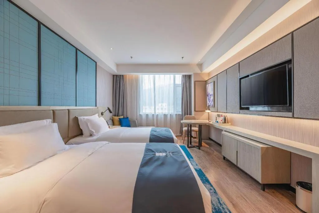 Bed in Echarm Hotel Tai'an Taishan Tianwai Village Hongmen