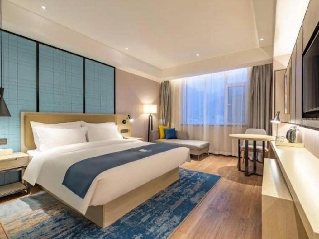 Bed in Echarm Hotel Tai'an Taishan Tianwai Village Hongmen