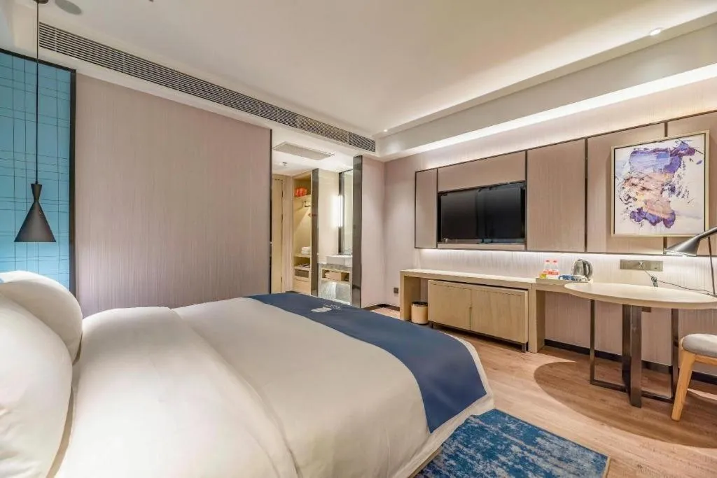 Bed in Echarm Hotel Tai'an Taishan Tianwai Village Hongmen