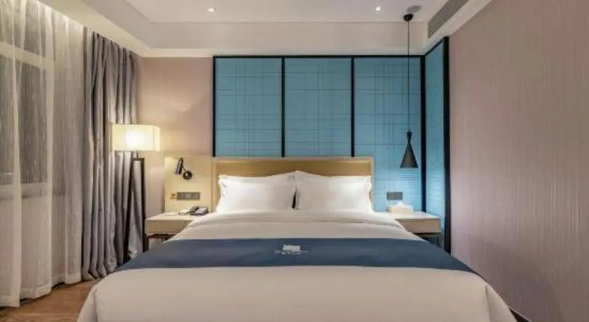 Bed in Echarm Hotel Tai'an Taishan Tianwai Village Hongmen