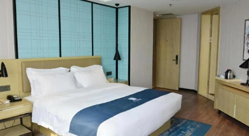 Bed in Echarm Hotel Tai'an Taishan Tianwai Village Hongmen