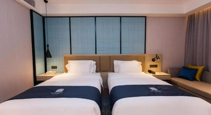 Bed in Echarm Hotel Tai'an Taishan Tianwai Village Hongmen