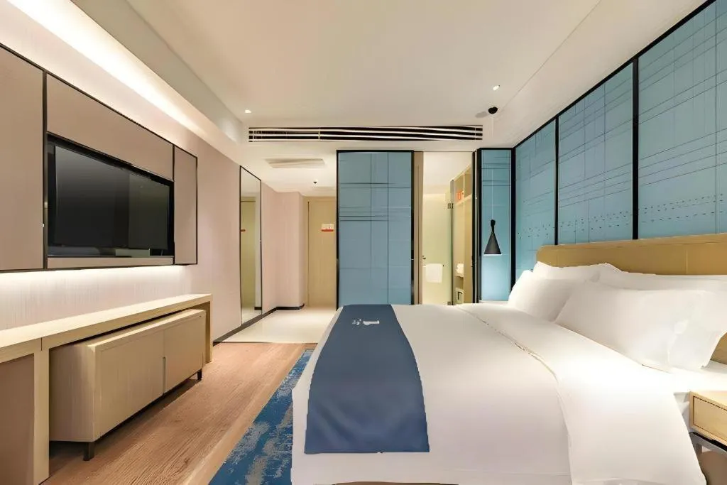 Bed in Echarm Hotel Tai'an Taishan Tianwai Village Hongmen