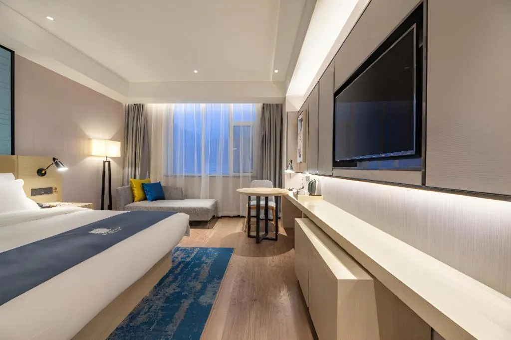 Bed in Echarm Hotel Tai'an Taishan Tianwai Village Hongmen