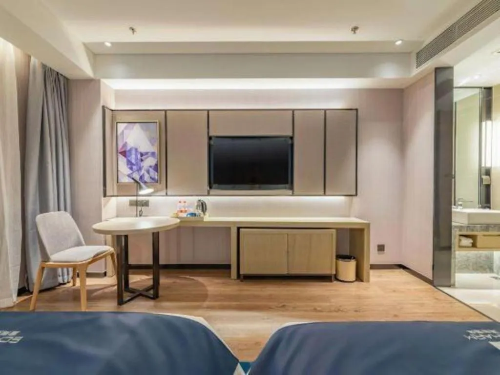 Bed in Echarm Hotel Tai'an Taishan Tianwai Village Hongmen