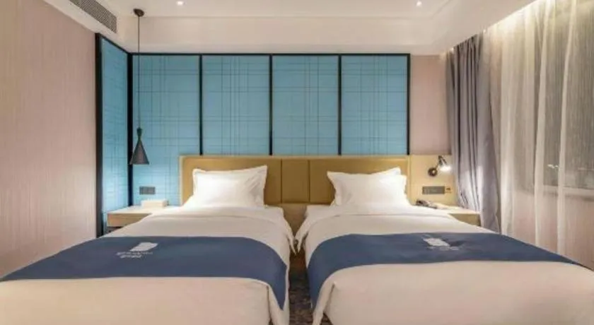 Bed in Echarm Hotel Tai'an Taishan Tianwai Village Hongmen