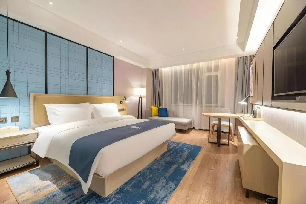 Bed in Echarm Hotel Tai'an Taishan Tianwai Village Hongmen