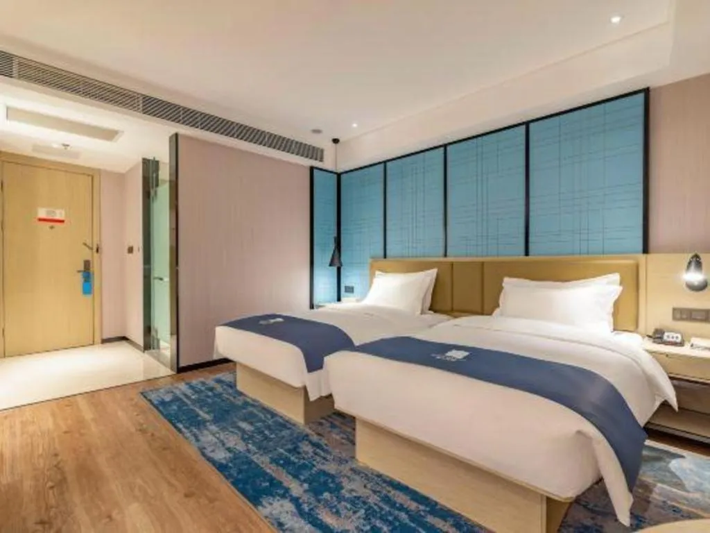 Bed in Echarm Hotel Tai'an Taishan Tianwai Village Hongmen