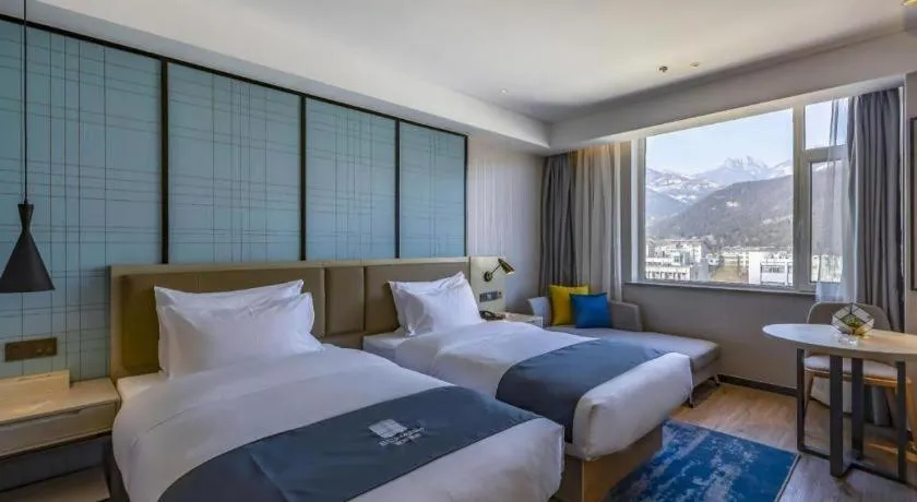 Bed in Echarm Hotel Tai'an Taishan Tianwai Village Hongmen