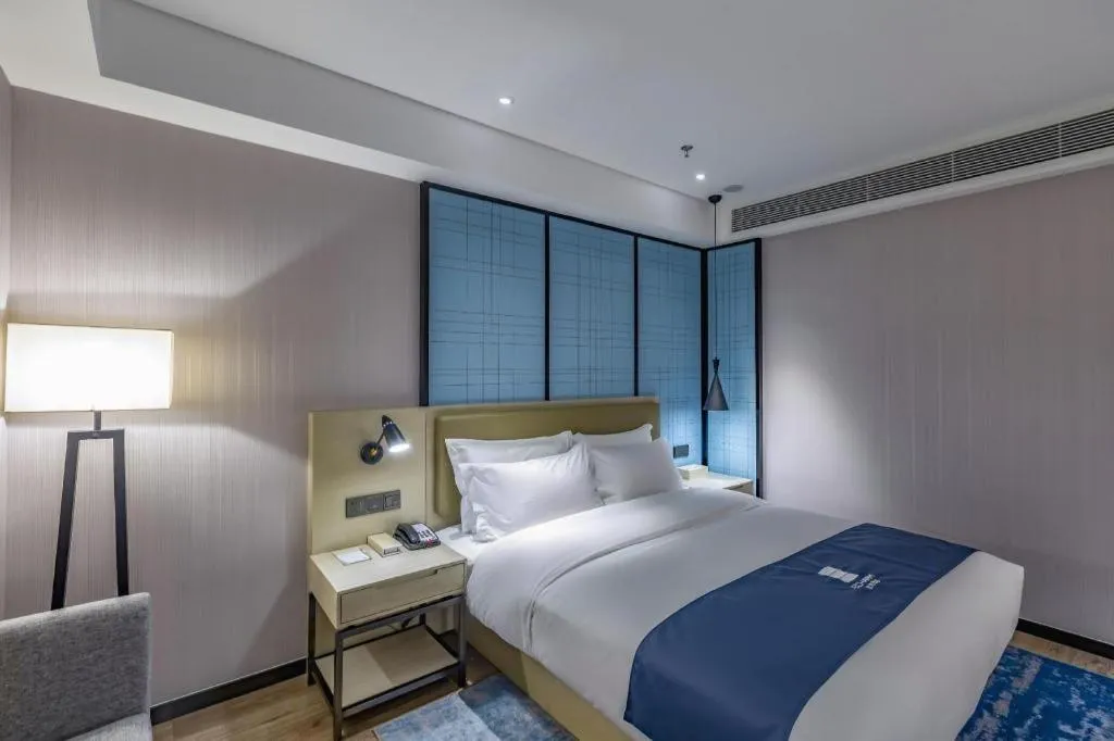 Bed in Echarm Hotel Tai'an Taishan Tianwai Village Hongmen