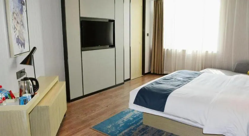 Bed in Echarm Hotel Tai'an Taishan Tianwai Village Hongmen