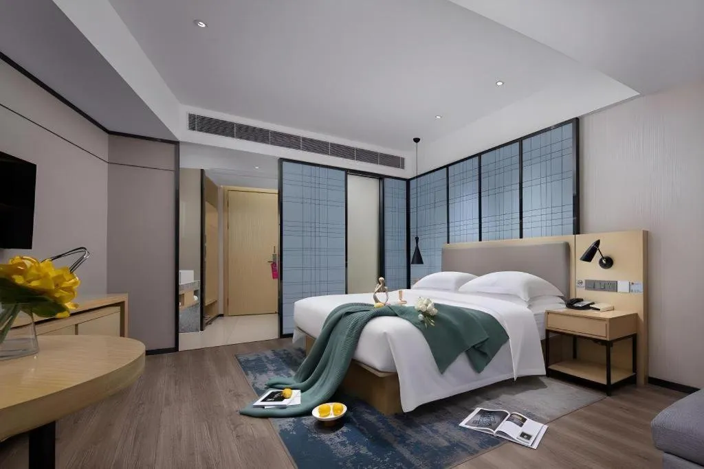 Bed in Echarm Hotel Tai'an Taishan Tianwai Village Hongmen