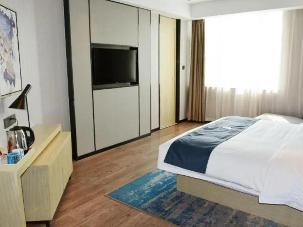 Bed in Echarm Hotel Tai'an Taishan Tianwai Village Hongmen