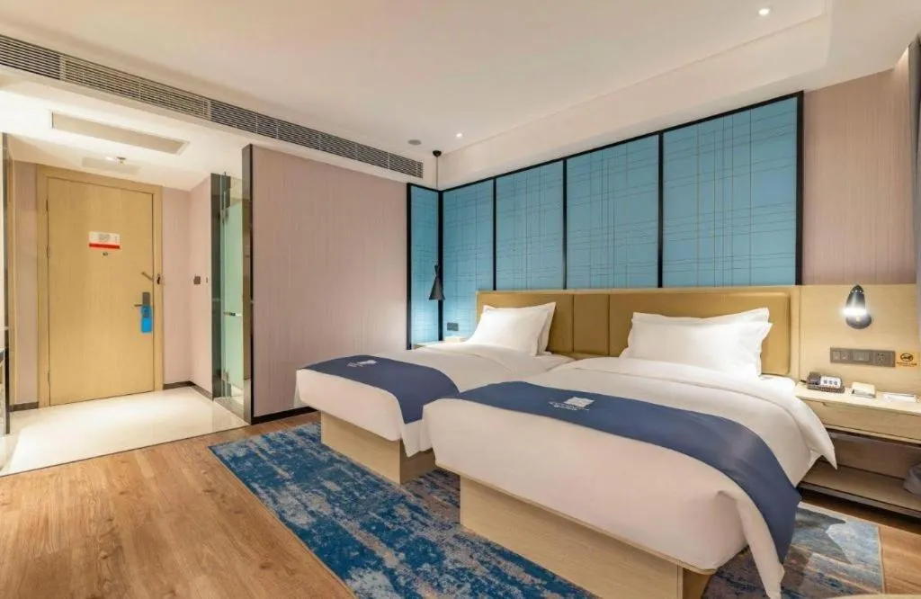 Bed in Echarm Hotel Tai'an Taishan Tianwai Village Hongmen